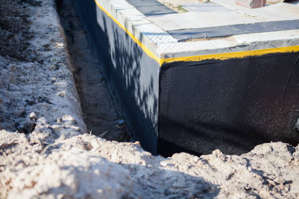 Professional Waterproofing technician working in Newbern, TN
